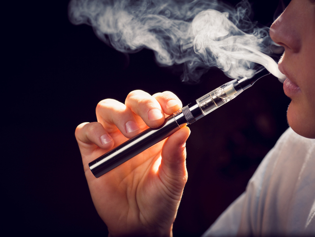 inhaling from an electronic cigarette.